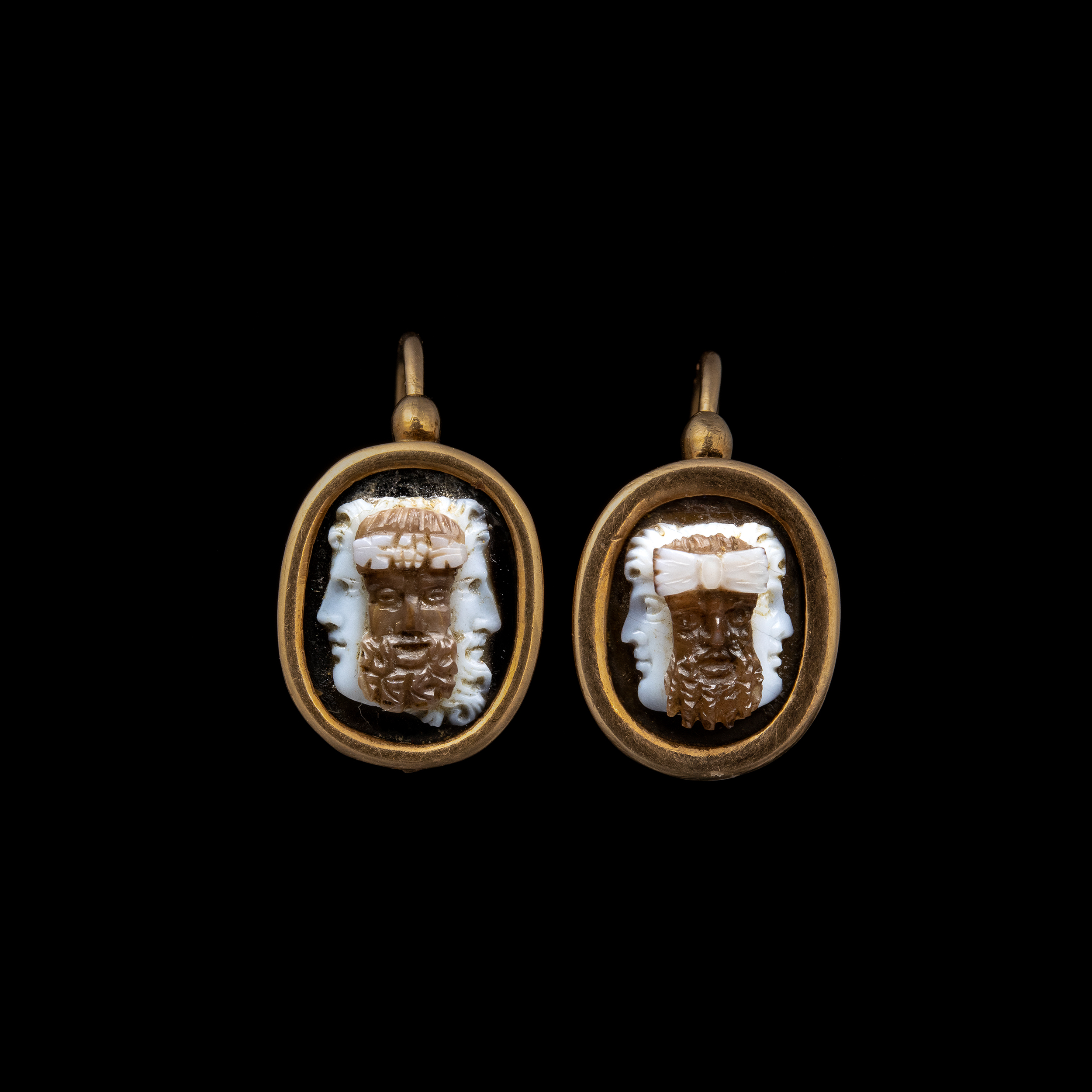 A 19th c. gold pair of earrings with agate cameos. Masks.